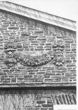 Photograph of a stone decoration on the Henry Hicks Arts & Administration Building
