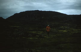 Photograph of McK. Porter walking in Cape Dorset, Northwest Territories