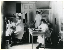 Photograph of a young girl getting a medical examination