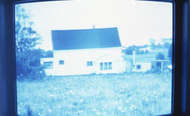 Photograph of house with garden