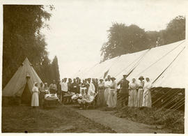 In the Sunshine at Argues, a convoy of German Prisoners with the tent hospital