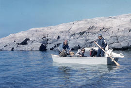 Photograph of several people in a small boat near George River, Quebec