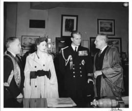 Photograph of Dr. Kerr, Princess Elizabeth, the Duke of Edinburgh, and Colonel Laurie