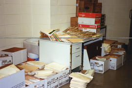 Photograph of files and boxes removed from shelving after the 1998 fire in the Killam Library