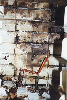 Photograph of a fire damaged wall