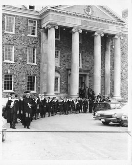 Photograph of a convication procession outside of King's College