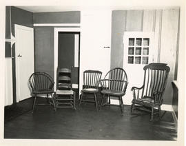 Photograph of a collection of chairs in the restored kitchen of the Simeon Perkins house