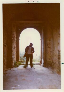 Photograph of a man in Castello dell Abate by P. Dohrn