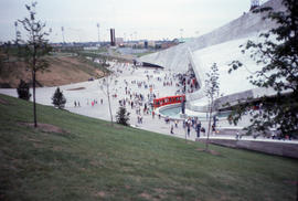 Photograph of the side of the stadium and people walking