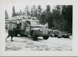 Photograph of an S.J. Haslam truck carrying hemlock logs in Porters Lake