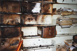 Photograph of shelves and documents damaged in the 1998 fire in the Killam Library