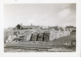 Photograph of stacks of pulpwood lumber prepared for export at Yarmouth