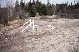 Photograph of a vandalized Irving sign near Fundy National Park, New Brunswick