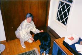 Photograph of Elisabeth Mann Borgese and a dog