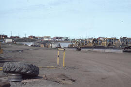 Photograph of parked excavation equipment on the outskirts of Tuktoyaktuk, Northwest Territories
