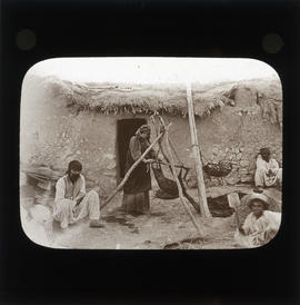 Photograph of people outside of a home