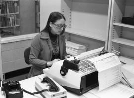 Photograph of Paddy Burt working at the Killam Library, Dalhousie University