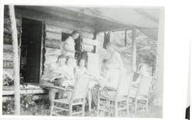 Photograph of Edith and Thomas Head Raddall eating with friends at a table outside Geetpoo Lodge,...