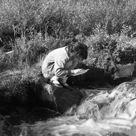Photograph of Jeannie panning for gold in the Yukon