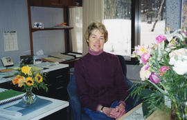 Photograph of Barbara Nielsen at her desk in the Killam Memorial Library