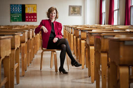 Publicity photograph of Jessica Kerrin sitting in a classroom