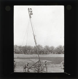 Photograph of unidentified soldiers raising flag
