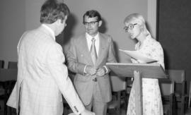 Photograph of three unidentified people at the law school opening