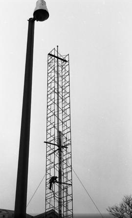 Photograph of a flag pole being repaired