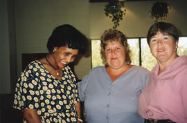 Photograph of Asmeret Gheabreab, Audrey LaPierre and Kelly Casey at a group baby shower held in t...