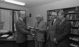 Photograph of a cheque presentation in the department of social work