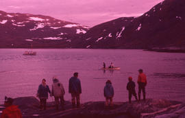 Photograph of several people standing on the shore in Ikkudliayuk, Labrador