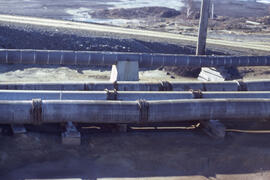 Photograph of wooden corrosion-resistant tailing slurry pipes, Copper Cliff, near Sudbury, Ontario