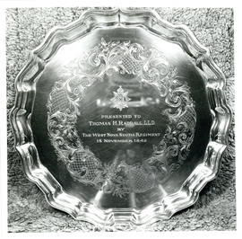 Photograph of a silver plate presented to Thomas Head Raddall by the West Nova Scotia Regiment