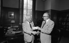 Photograph of Oland's presenting a cheque to Henry Hicks