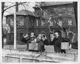 Photograph of servicemen drinking looted Keith's beer in front of Government House during the Hal...