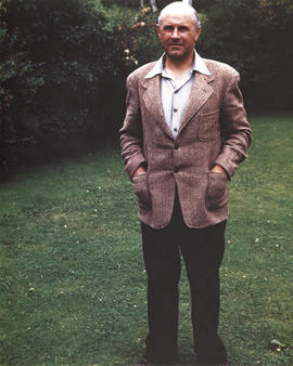 Photograph of Thomas Head Raddall standing in his garden