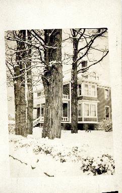 Photograph of a house in winter in Liverpool, Nova Scotia printed on a postcard