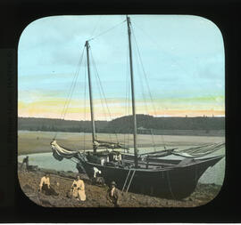 Photograph of people standing in front of schooner