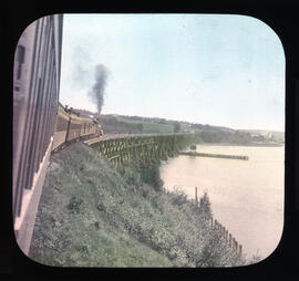 Photograph of train crossing a wooden bridge