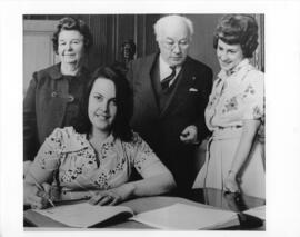 Photograph and a photographic negative of the signing of the contract between the Dalhousie Staff...