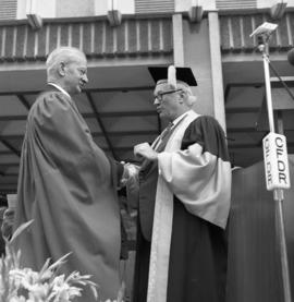 Photograph of Dr. Gordon B. Wiswell receiving an honorary degree