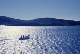Photograph of a small boat on the water in Emily Harbour, Newfoundland and Labrador