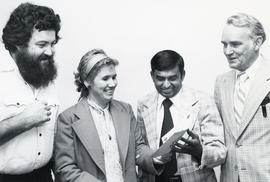 Photograph of Intab Ali and three unidentified people