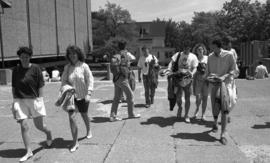 Photograph of students walking by the Killam Library