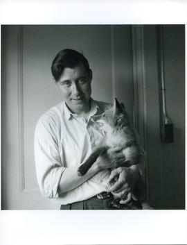 Photograph of George Koneak holding a fox in Fort Chimo, Quebec