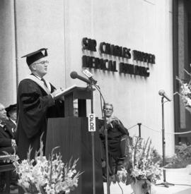 Photograph of Chester Stewart speaking at the Dalhousie medical centennial convocation