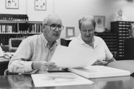 Photograph of Bill Birdsall, University Librarian, and an unidentified man in the Special Collect...