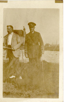 Photograph of T.H. Raddall, Sr. in uniform while on leave in England with a non-uniformed man