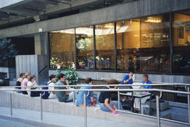 Photograph of patrons and staff at the Killam Web Café in the atrium of the Killam Memorial Library
