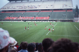 Photograph of a soccer match featuring Iran versus Cuba